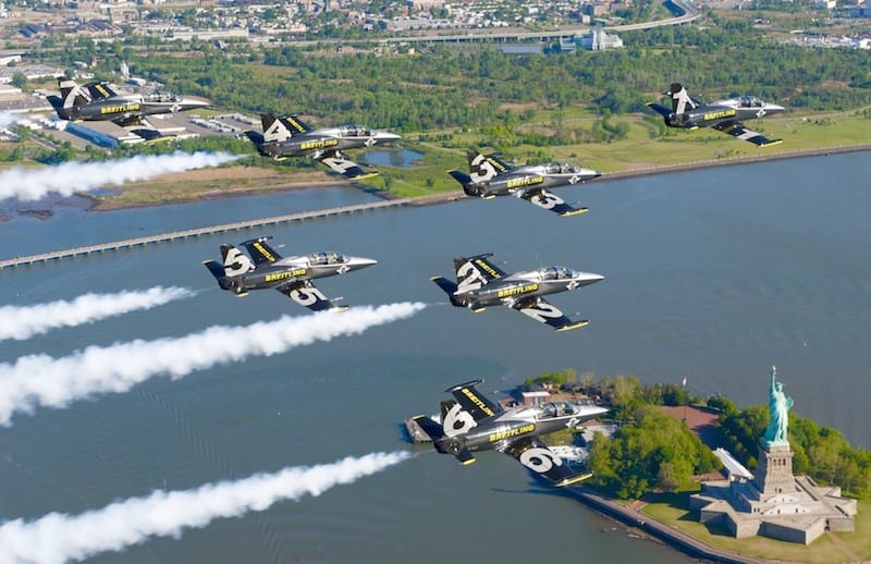 The Breitling Jet Team flies over the Statue of Liberty.