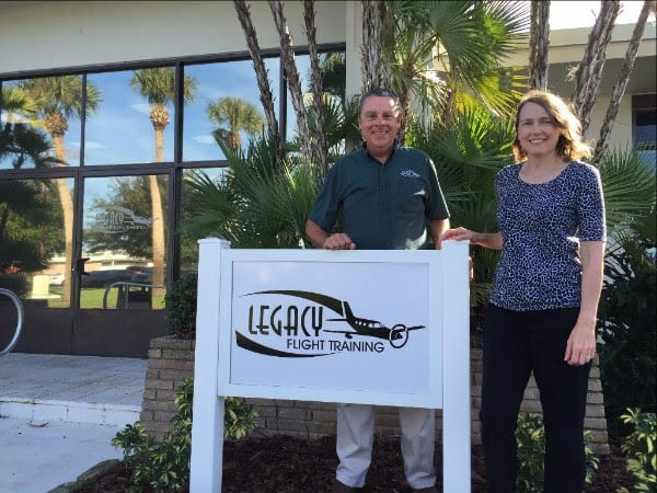 Legacy Flight Training, Inc. Owners Bill & Diane Inglis in front of new Vero Beach training center.