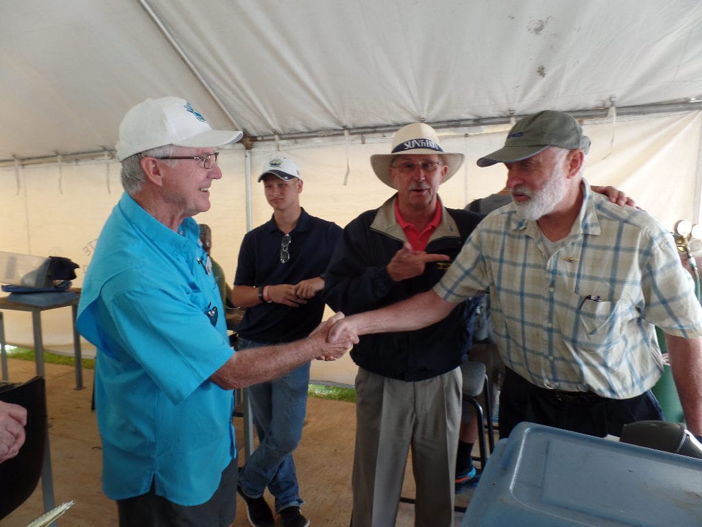 Eisner receives his 30-year pin from Leenhouts and Heacock.