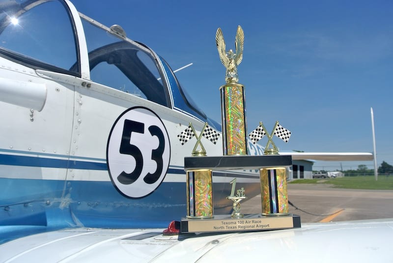 Air Racer William E. Dubois with Race 53 and their First Place in Class trophy on the tarmac at KGYI following the awards ceremony. (Photo by Rio A. F. Dubois)