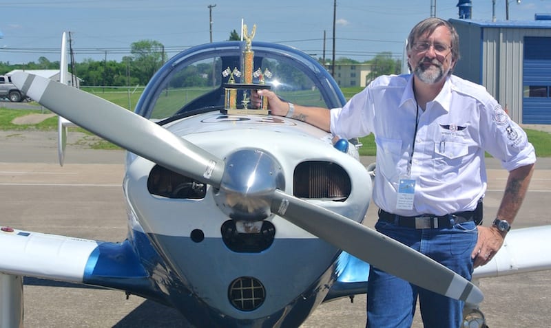 Air Racer William E. Dubois with Race 53 and their First Place in Class trophy on the tarmac at KGYI following the awards ceremony. (Photo by Rio A. F. Dubois)