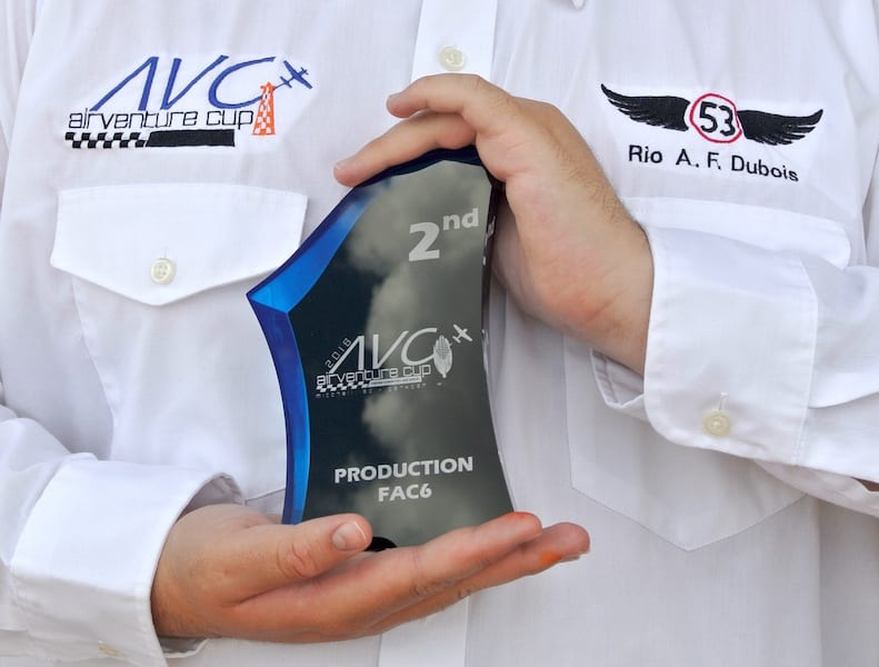 Now and forever an air racer, 14-year-old Rio A. F. Dubois displays the 2nd Place Fac 6 Class trophy he and his father won in the 19th Annual AirVenture Cup. (Photo by William E. Dubois)