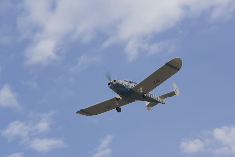 Race 53 arriving at Mitchell, SD, the day before the AirVenture Cup. The plan had been to arrive a day earlier, but racing is full of uncertainties. Triple-digit temps across the Midwest, and a flat tire on the nose gear caused delays. Note the newest speed mod: Nose gear pants. (Photo by Lisa F. Bentson)