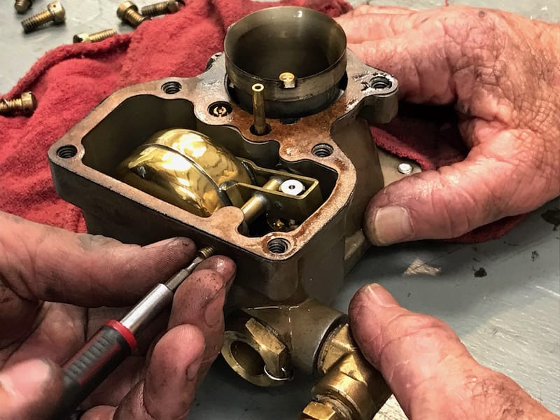 Hidden treasure: The fuel float inside the antique Stromberg carburetor is polished brass, a thing of beauty. (Photo by William E. Dubois)