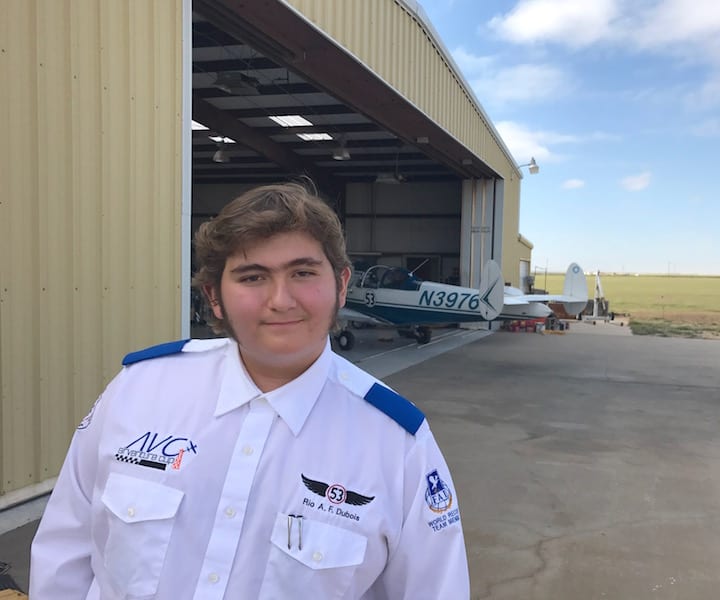 Copilot Rio A. F. Dubois with a sick friend in the background. The 14-year-old student pilot wasn’t optimistic that his father would make the race. He was proven right. (Photo by William E. Dubois)