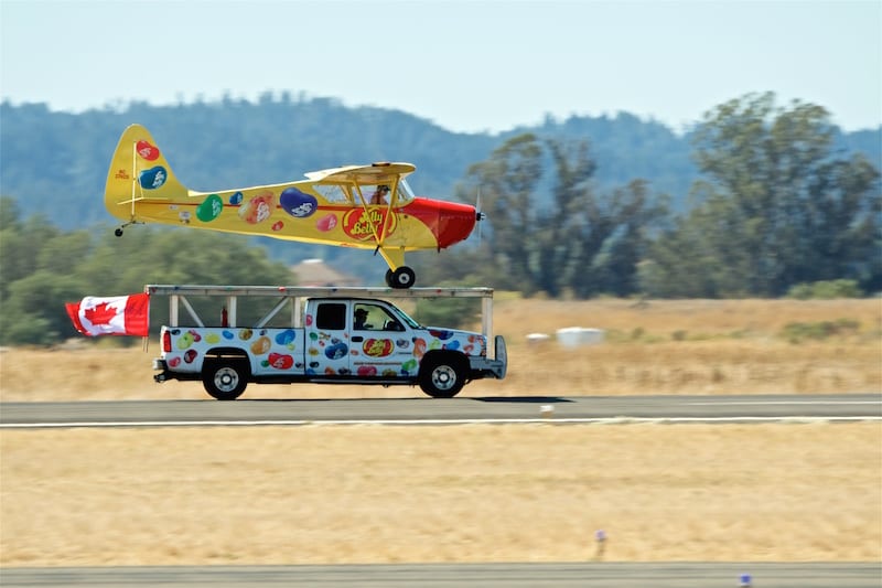 Kent Pietsch lands his 1941 Interstate Cadet on top of a pickup truck, just one of the three performances he did during the show.