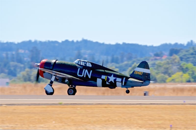 A Republic P-47G Thunderbolt, visiting from the Planes of Fame museum, rumbles into the air for some warbird flybys.