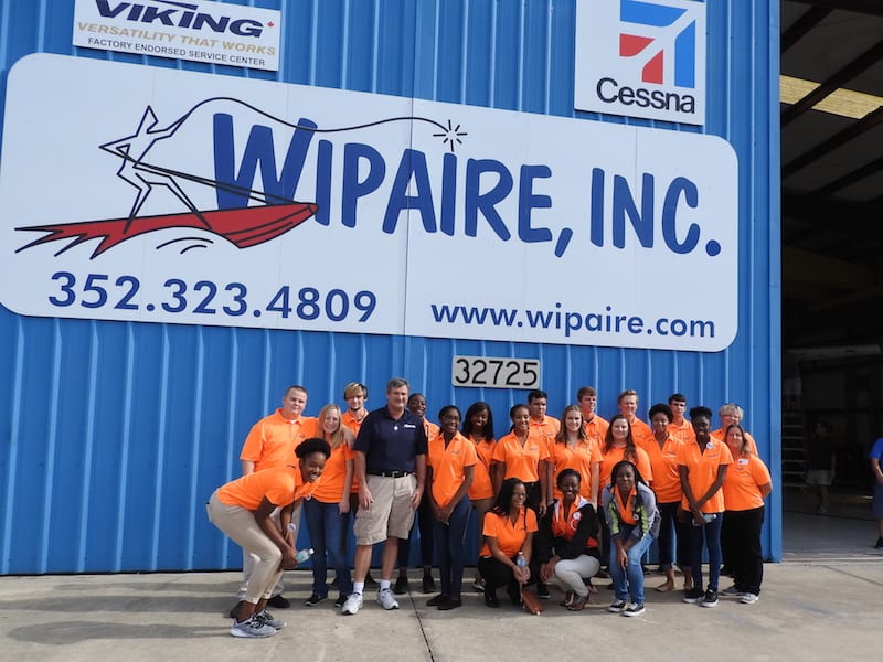 Bill Pike ( blue shirt ) was the Wipaire host for the Spark students.