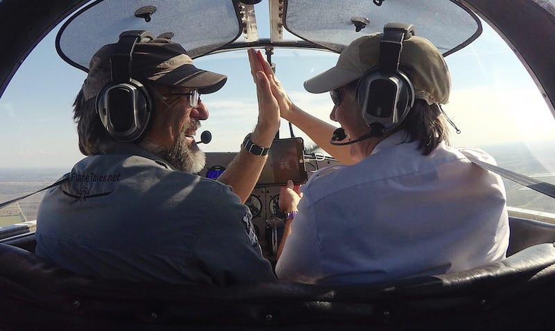 A high five over the finish line as Air Racer William E. Dubois and copilot Lisa F. Bentson complete the last race of the 2016 Sport Air Racing League season. (Photo by Lisa F. Bentson)