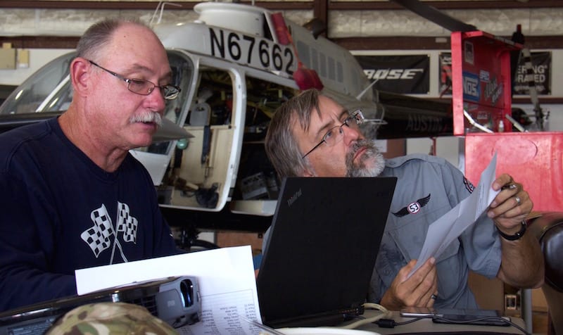 Crunching the math, League Chairman Mike Thompson and air racer William E. Dubois try to make sense out of “triple-checked” math that put the Ercoupe at an improbably fast race speed. In the end, a simple handwriting error was suspected—a quickly drawn nine resembling a zero when the finish time was recorded. Racers use in-cockpit data recorders—or even simple stopwatches—to protect their reputations from just such rare occurrences. Dubois was able to check his CloudAhoy app to ensure that all his turns were legal. They were, but barely. Race 53 corkscrewed tightly around all the virtual pylons. (Photo by Lisa F. Bentson)