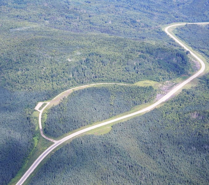 The Alaska Highway below in the Yukon Territory provides a welcome navigation marker.