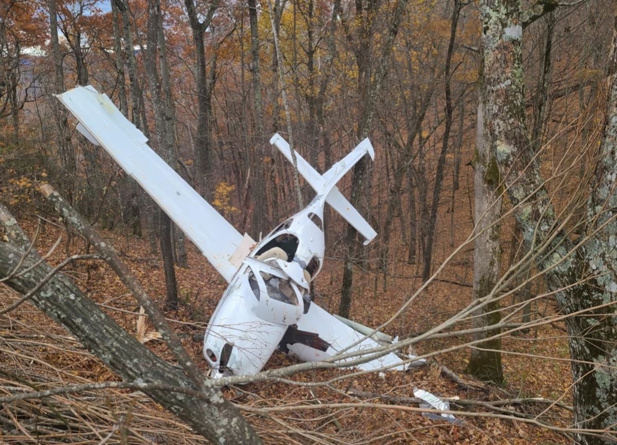 Small plane crashes into car during emergency landing in North